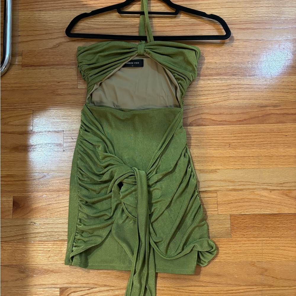 Open stomach, super cute mini dress with one shoulder strap.